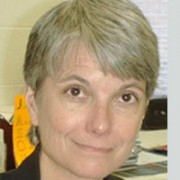 Smiling woman with a gray pixie haircut